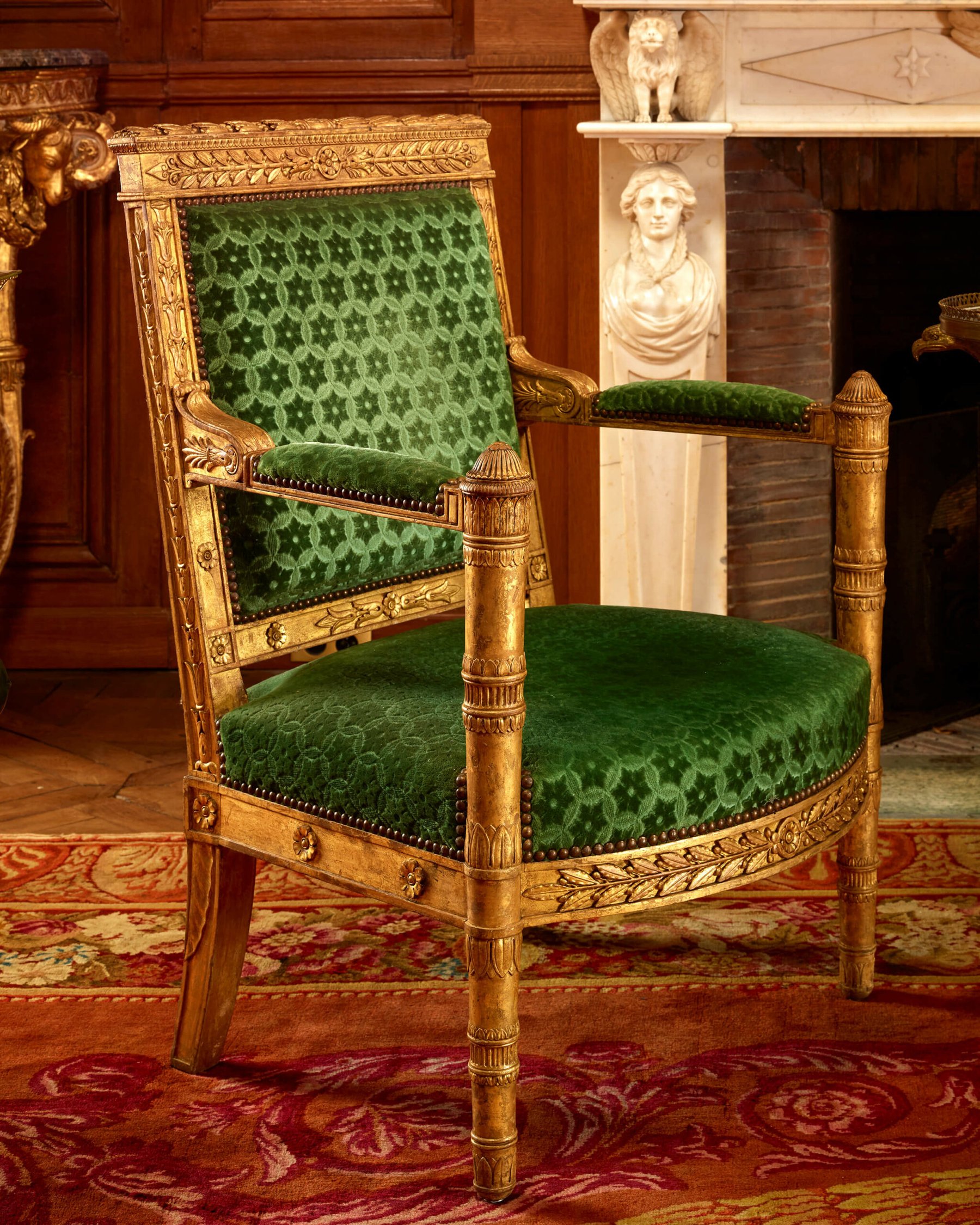 Historic green velvet upholstered armchair